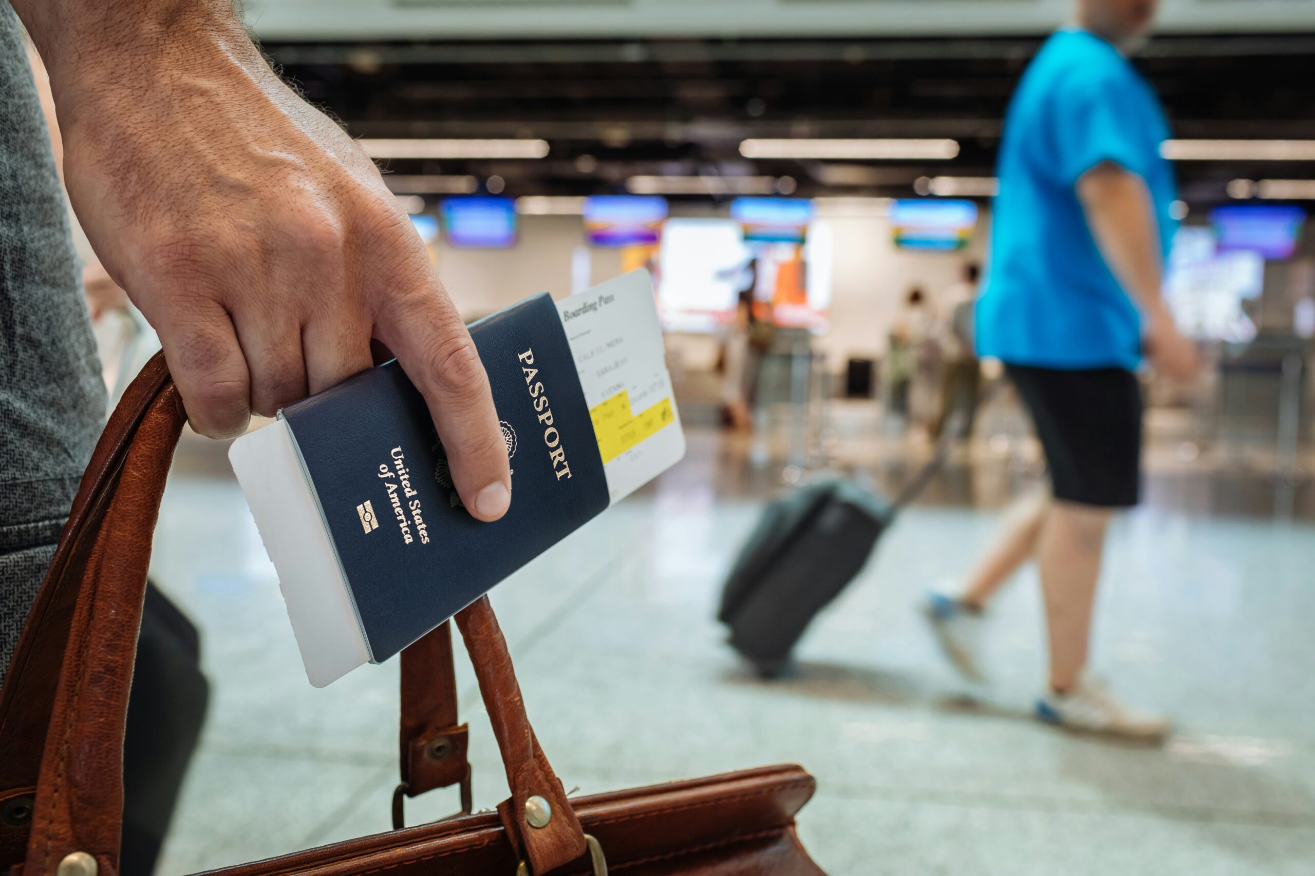 Person holding passport to travel